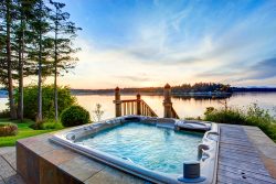 Awesome,Water,View,With,Hot,Tub,In,Summer,Evening.,House