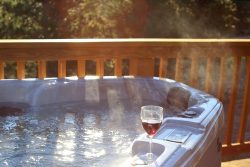Steaming,Hot,Tub,On,The,Deck,With,Wine,Glass